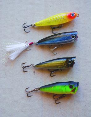 Some of the author's favourite topwater bream lures. From top, Lucky Craft NW Pencil, Lucky Craft Bevy Popper, Sure Catch popper, River 2 Sea 45mm popper.